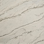 Calacatta quartzite slab featuring grey veining on a beige background. Calacatta quartzite slab with grey veining on beige background