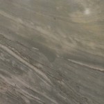 Calais quartzite slab featuring grey and beige flowing patterns. Calais quartzite slab with grey and beige flowing patterns