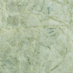 Madre Perla quartzite slab featuring light green and beige crystalline patterns, ideal for countertops in Mundelein. Madre Perla quartzite slab with light green and beige crystalline patterns from Mundelein.