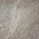 Taj Mahal quartzite slab featuring a creamy beige background with soft grey veining. Taj Mahal quartzite slab with creamy beige background and soft grey veining