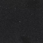 Jet Black quartz countertop slab featuring solid deep black color and subtle texture, ideal for modern kitchens in Winnetka. Jet Black quartz countertop slab with solid deep black color and subtle texture in Winnetka.