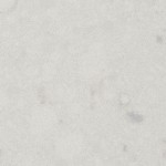 Misty Carrera quartz surface featuring a soft white background with subtle grey speckles. Misty Carrera quartz surface with soft white background and subtle grey speckles
