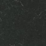 Dark grey quartz with subtle white veins and speckles. Dark grey quartz surface with subtle white veining and speckles.