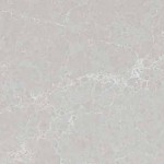 Light grey quartz with soft white veining and mist-like pattern. Light grey quartz surface with soft white veining and a mist-like pattern.