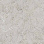 Off-white quartz with gentle grey veining and speckles. Off-white quartz surface with soft grey veining and speckled texture.