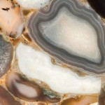Nebbia quartz countertop slab featuring translucent agate slices with beige, gray and white tones, ideal for countertops in Lombard. Nebbia quartz countertop slab featuring translucent agate slices with beige, gray and white tones in Lombard.