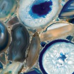 Profondo quartz countertop slab featuring geode-like agate slices in blue, teal and beige tones, ideal for countertops in Glenview. Profondo quartz countertop slab featuring geode-like agate slices in blue, teal and beige tones in Glenview.