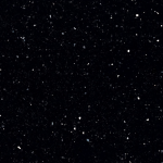 Menai quartz slab featuring a deep black background with shimmering reflective speckles in Warrenville Menai quartz slab with a deep black background and shimmering reflective speckles in Warrenville